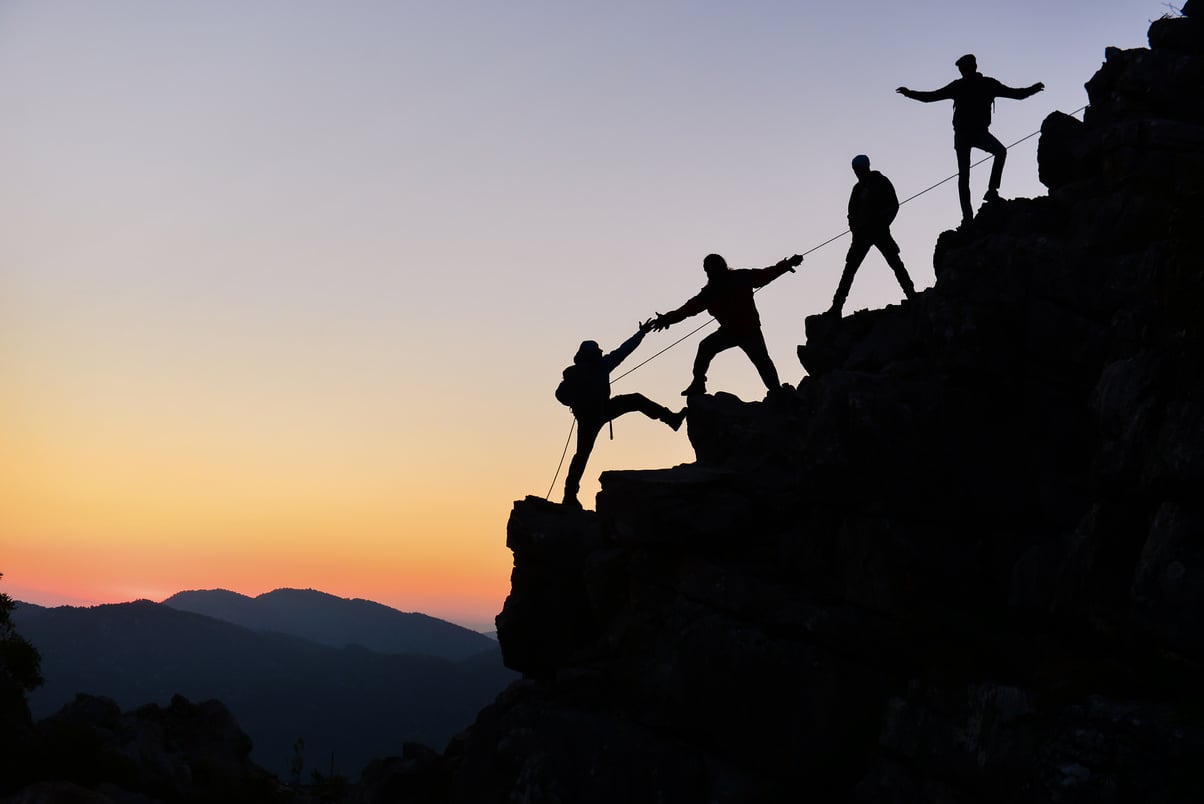 Climbers work in harmony and climb